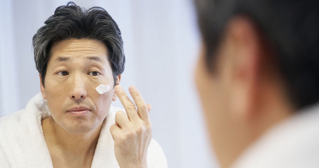 Chinese Man Applying Face Cream