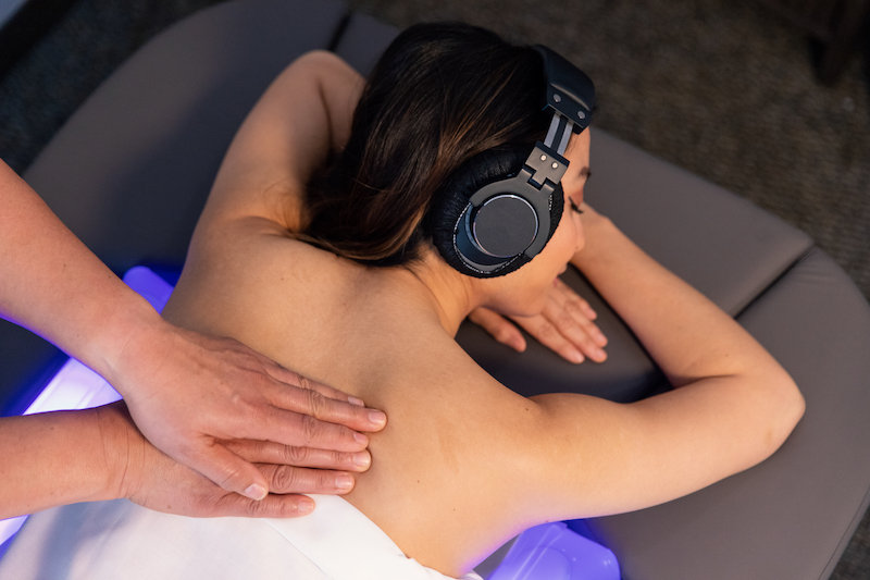 Immersive body massage with headphones